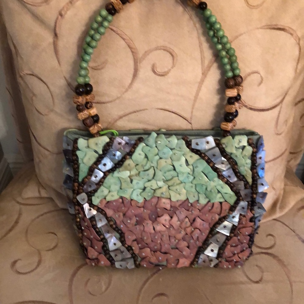 Stunning Pele turquoise/multicolor handbag.